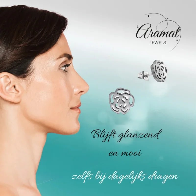 Aramat Jewels stainless steel open rose stud earrings worn by a woman, featuring a delicate floral design.