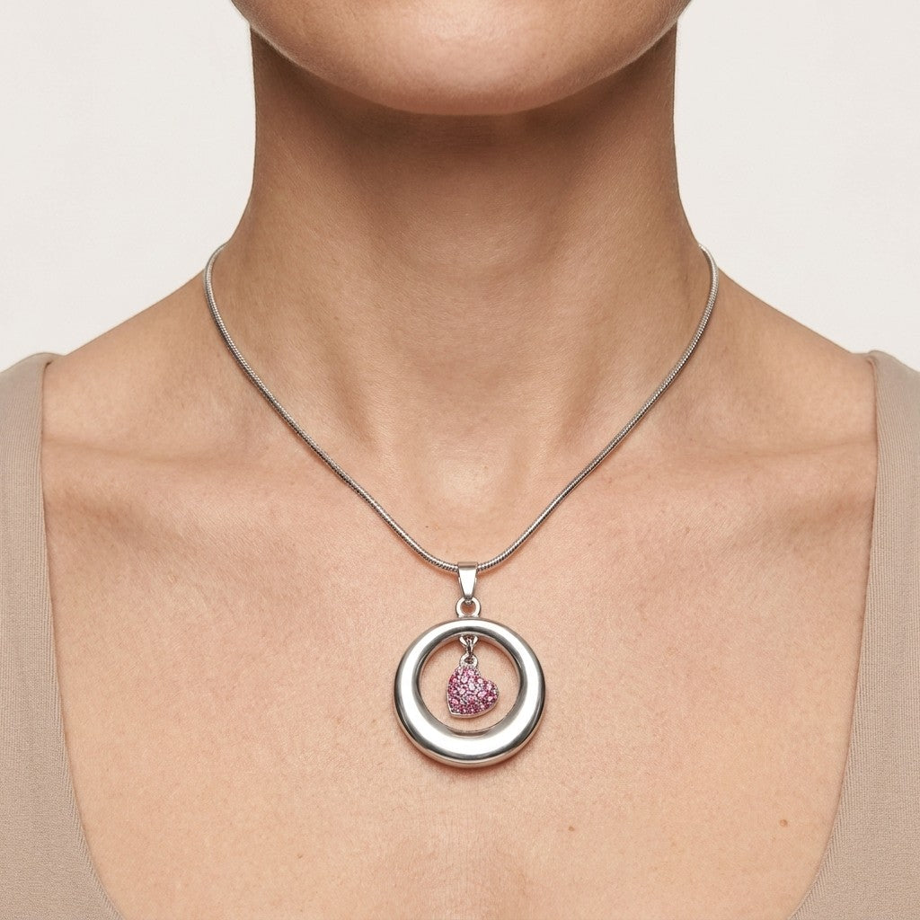 Aramat Jewels® stalen ashanger open cirkel met roze kristal hart, RVS gedenksieraad