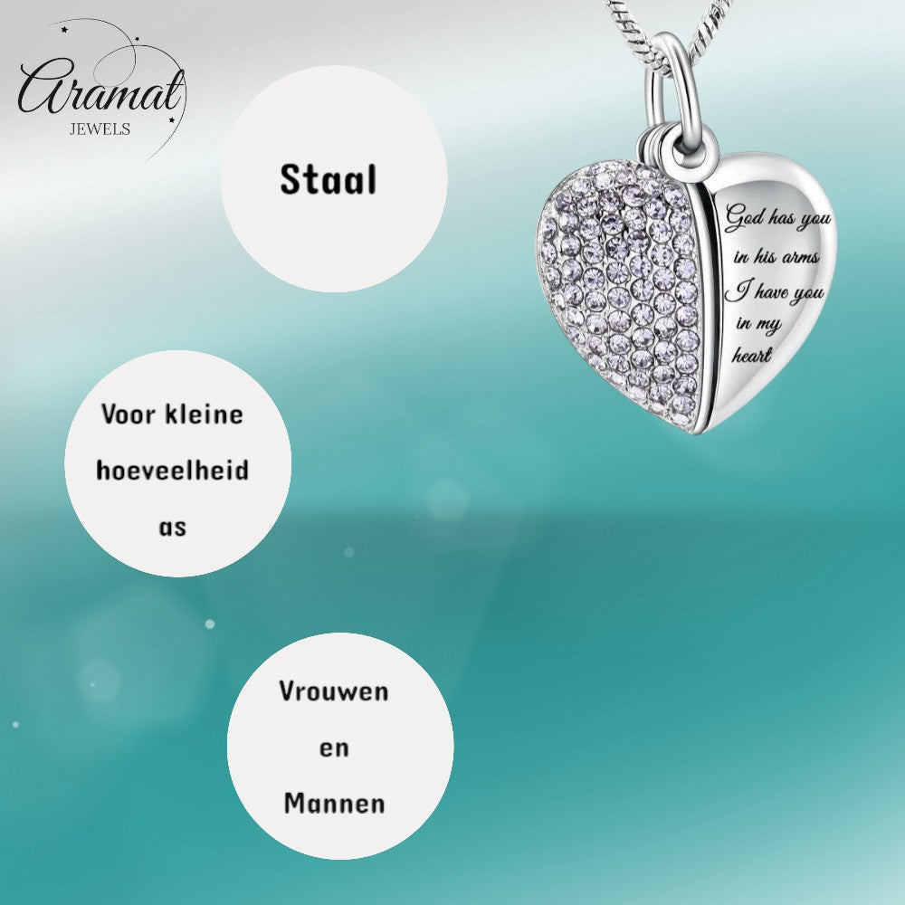 Aramat Jewels stalen hartvormige ashanger met lila kristallen en de tekst "God has you in his arms, I have you in my heart".