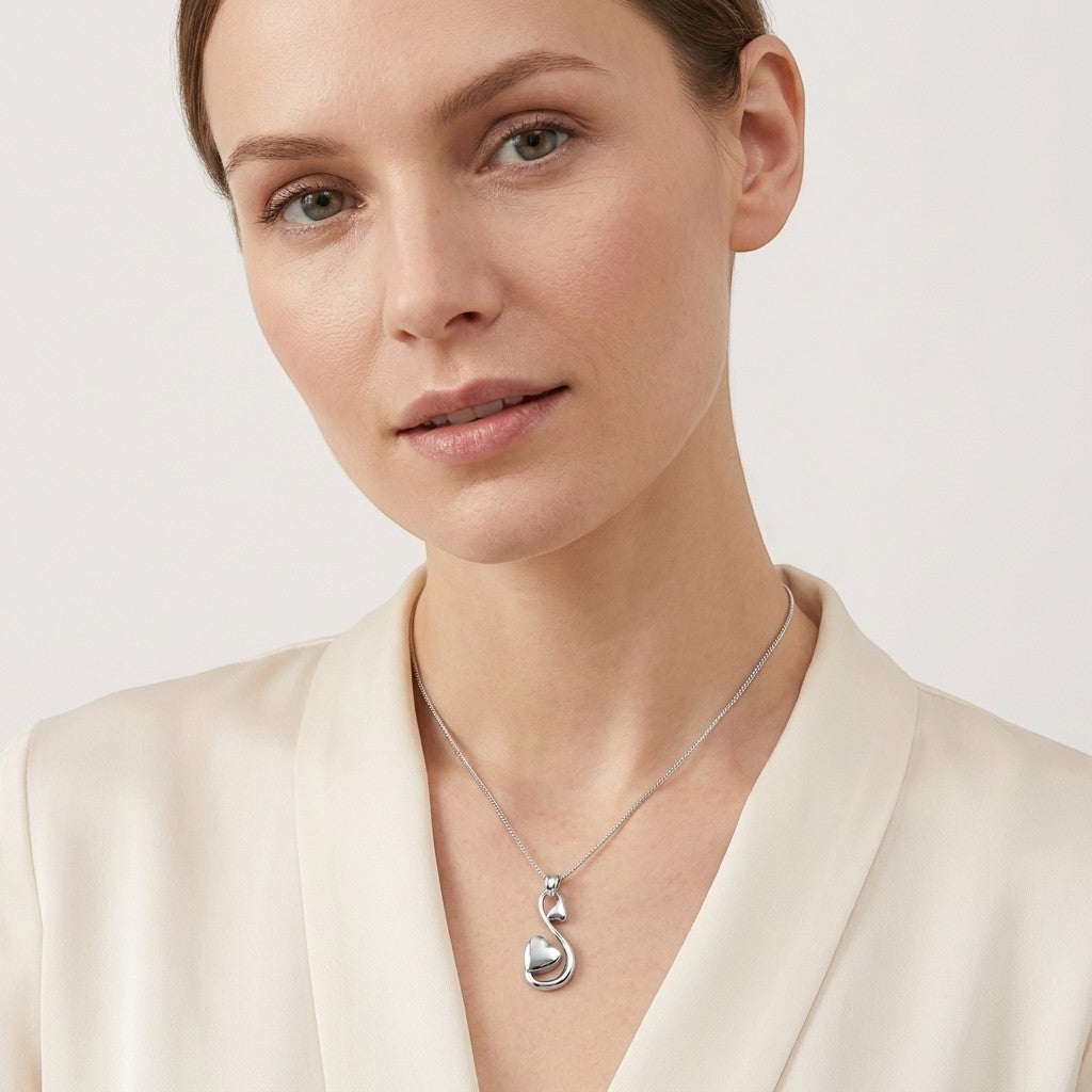 Aramat Jewels zilverkleurige stalen ashanger in sierlijk hartvorm, 38x18 mm, voor dames.