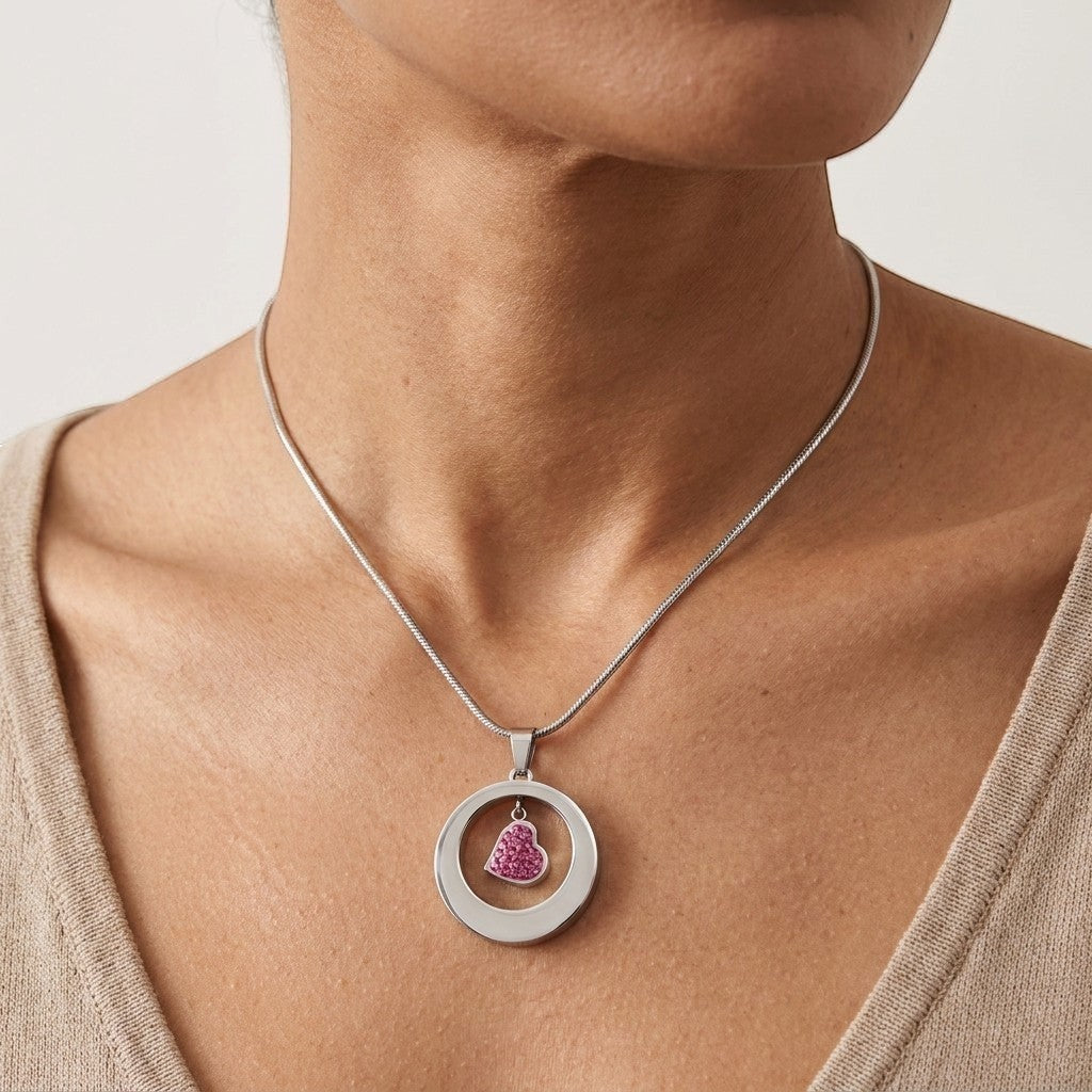 Aramat Jewels® zilverkleurige stalen ashanger rond met hartdetail, waterbestendig