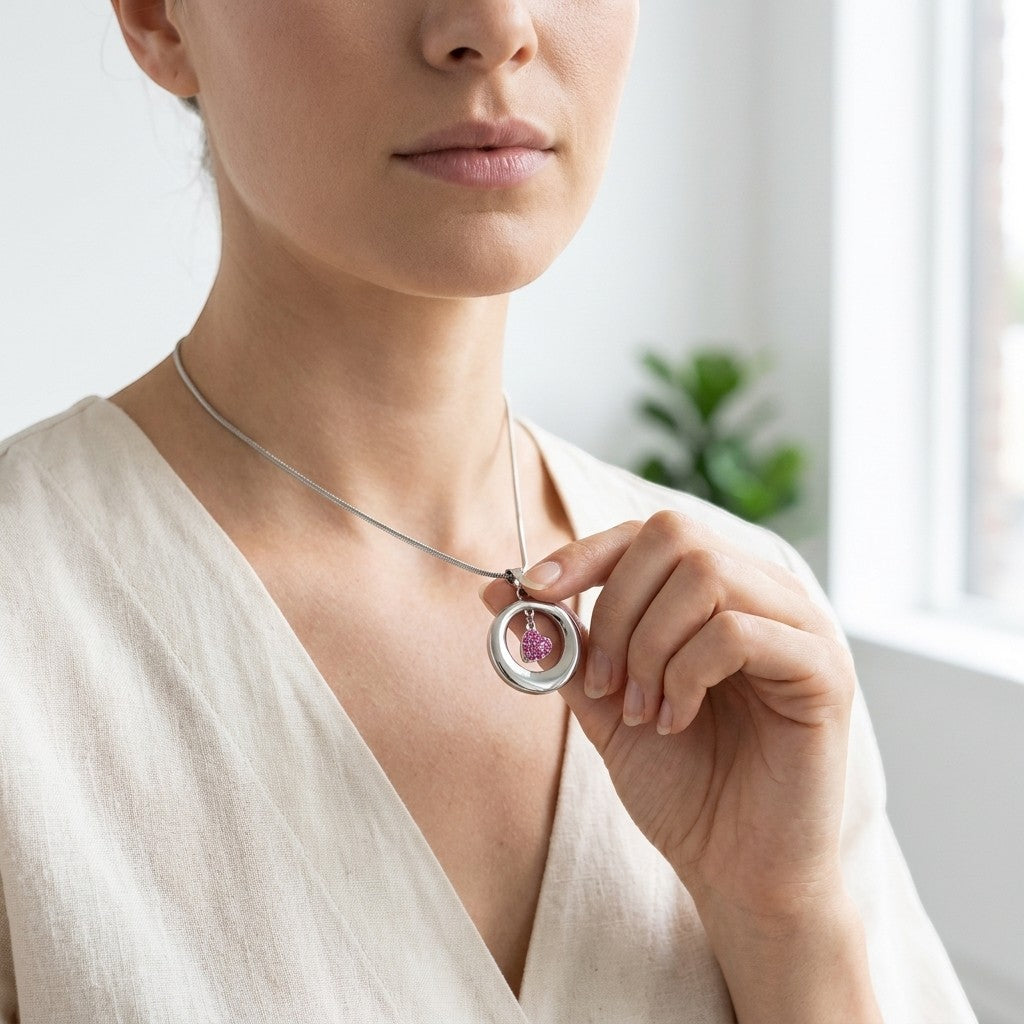 Aramat Jewels® stalen ashanger open cirkel met roze kristal hart, RVS gedenksieraad