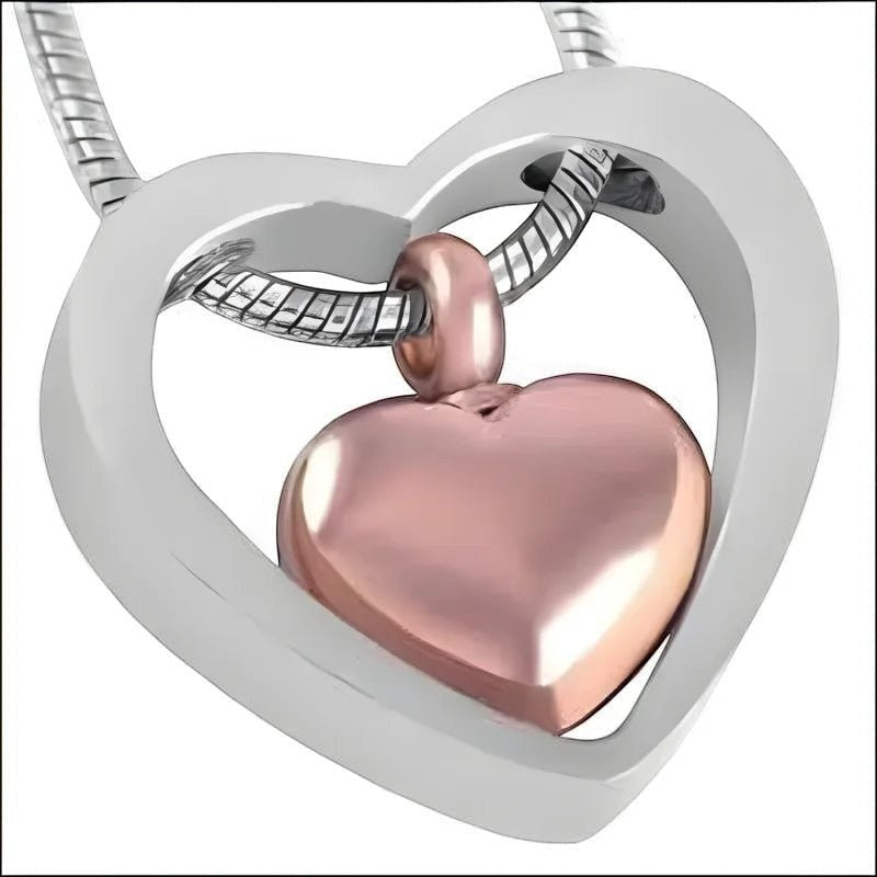 Aramat Jewels stalen hart crematiehanger in zilverkleurig en rosékleurig. Gedenksieraad met hartvormige binnenhanger.