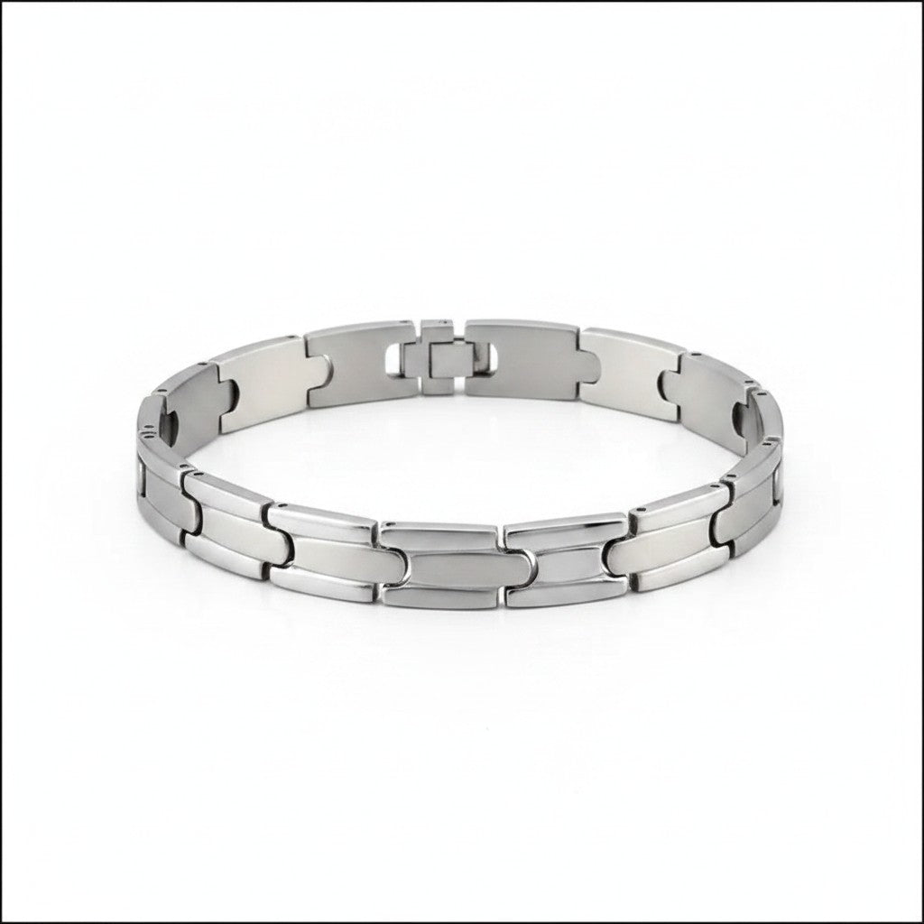 Zilverkleurige Aramat Jewels schakelarmband van 316L chirurgisch staal met een breedte van 9 mm en kliksluiting.