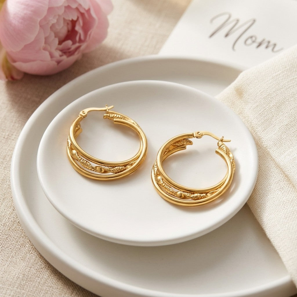 Aramat Jewels triple gold hoop earrings with a twisted detail, 30x7mm, made of stainless steel.