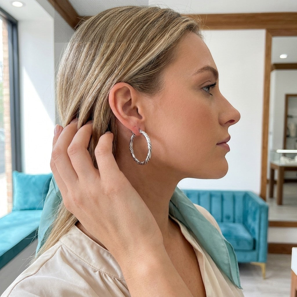 Aramat Jewels silver-tone stainless steel twisted hoop earrings, 30mm diameter, with a 3-strand rope design.