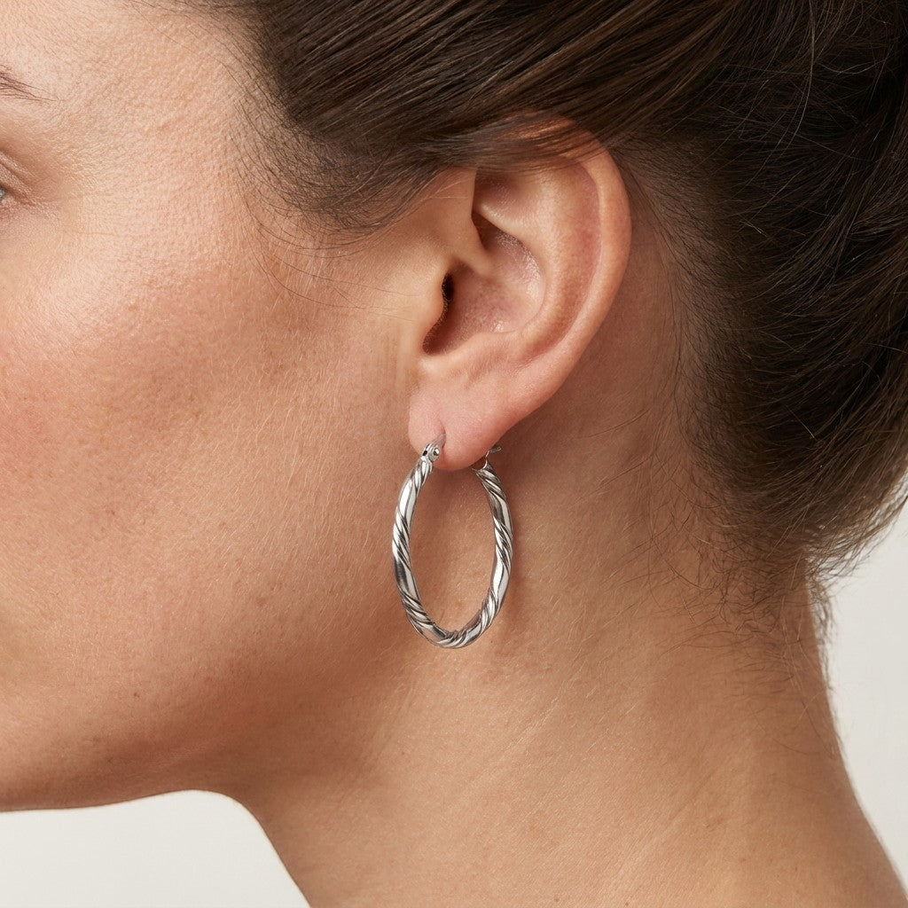 Aramat Jewels silver-tone stainless steel twisted hoop earrings, 30mm diameter, with a 3-strand rope design.