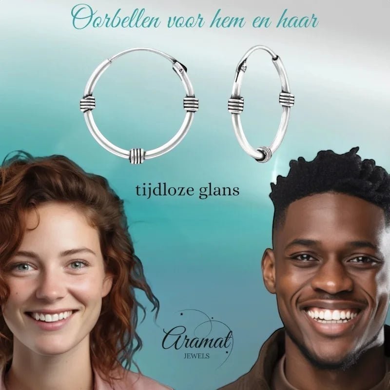 Aramat Jewels unisex silver Bali hoop earrings, 16mm diameter, with a textured band design. Shown on a smiling woman and man.