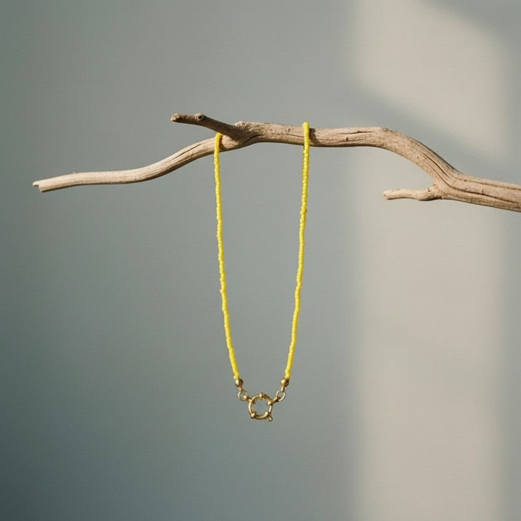 Aramat Jewels yellow rocailles beaded necklace with gold clasp and accents, 42cm length.