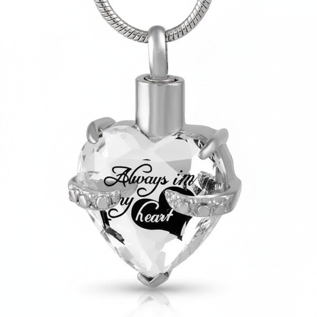 Aramat Jewels zilverkleurige hart crematiehanger van 316L staal met zirkonia en gravure 'Always in my heart'.