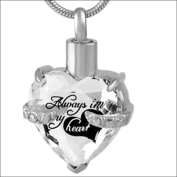 Aramat Jewels zilverkleurige hart crematiehanger van 316L staal met zirkonia en gravure 'Always in my heart'.