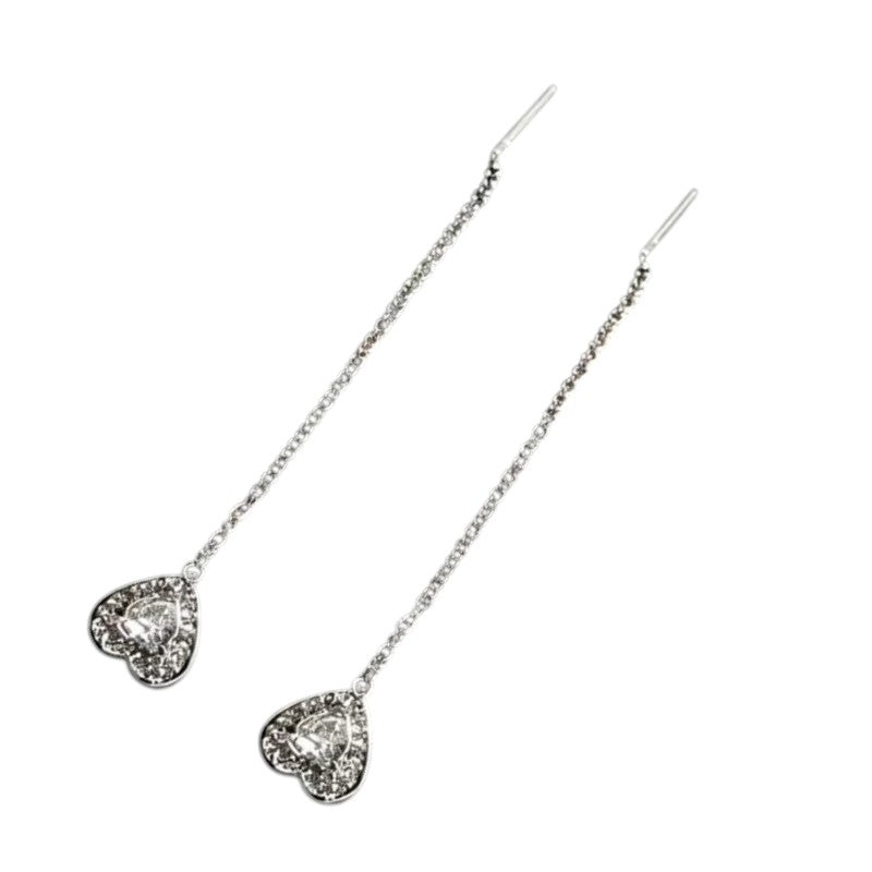 Aramat Jewels zilverkleurige doortrek oorbellen van RVS met een hartvormige hanger bezet met zirkonia steentjes.