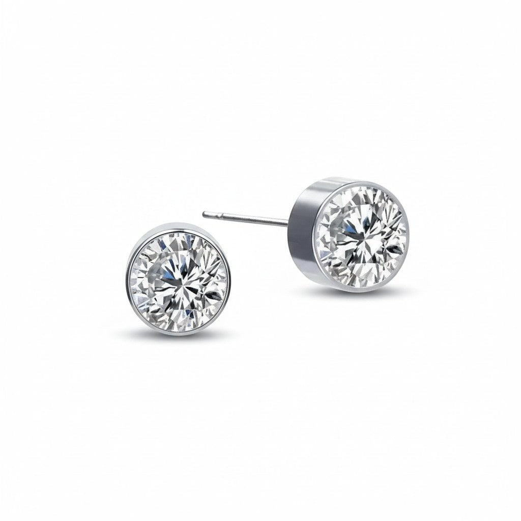Aramat Jewels zilverkleurige oorstekers met 6mm transparant kristal, gemaakt van roestvrij staal.