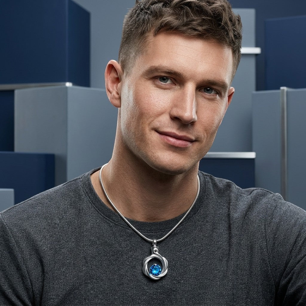 Aramat Jewels zilverkleurige stalen ashanger met blauwe zirkonia, voor mannen. Gedenksieraad zonder ketting.