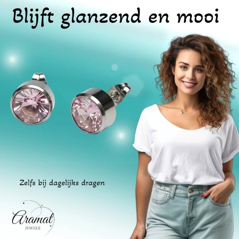 Aramat Jewels zilverkleurige oorstekers met 10mm roze kristal, gemaakt van roestvrij staal.