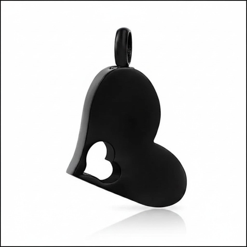 Aramat Jewels zwarte crematiehanger in de vorm van een hart met een open hart-design, gemaakt van 316L staal.