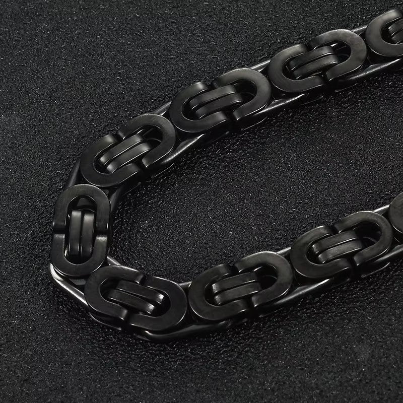 Aramat Jewels stoere zwarte koningsschakel armband van staal, 23 cm lang en 12 mm breed.
