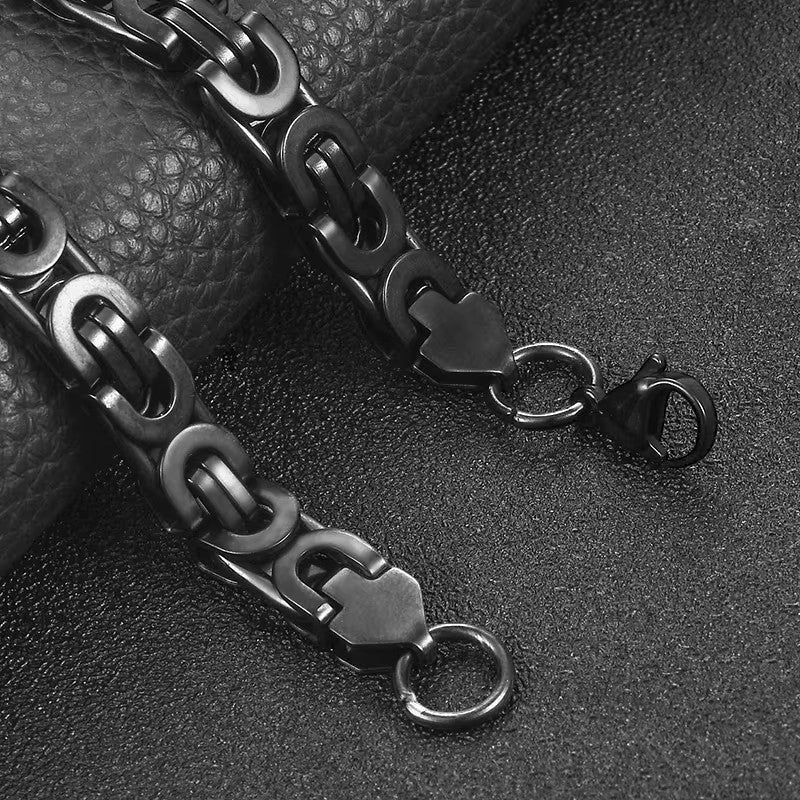Aramat Jewels stoere zwarte koningsschakel armband van staal, 23 cm lang en 12 mm breed.