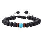 De zwarte lava armband met turquoise steen