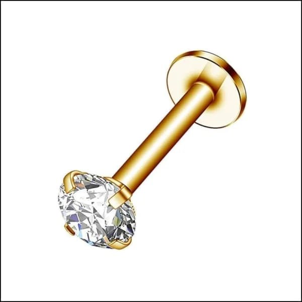 Een gouden neuspiercing met een enkele diamant erop