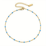 Een Gouden Armband Met Blauwe Kralen Van Aramat Jewels® Stalen Enkelbandje