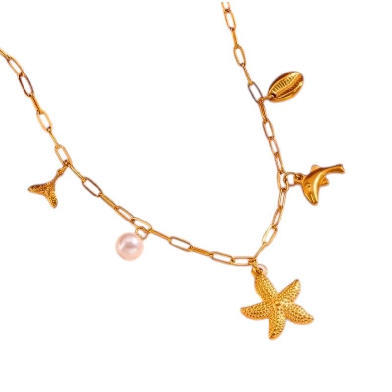 Goudkleurige damesketting met zee - bedels en parel – 45 cm - ket1170 - 511142 - Halskettingen kopen# - 45cm - alles - Bedelketting