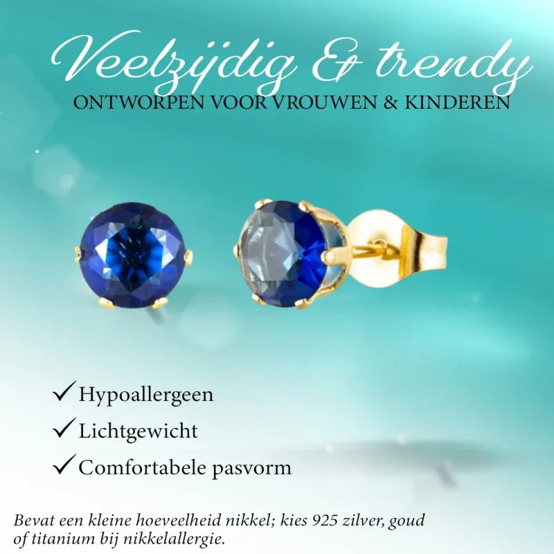 Gouden oorbellen met blauwe edelstenen.