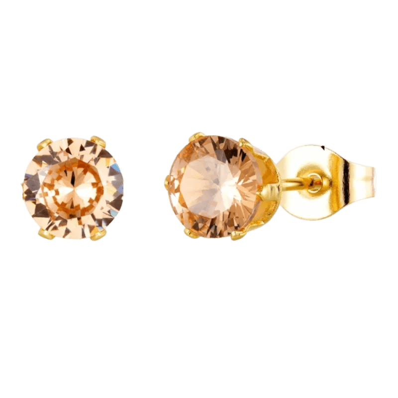 Paar gouden oorbellen met ronde champagnekleurige edelstenen.