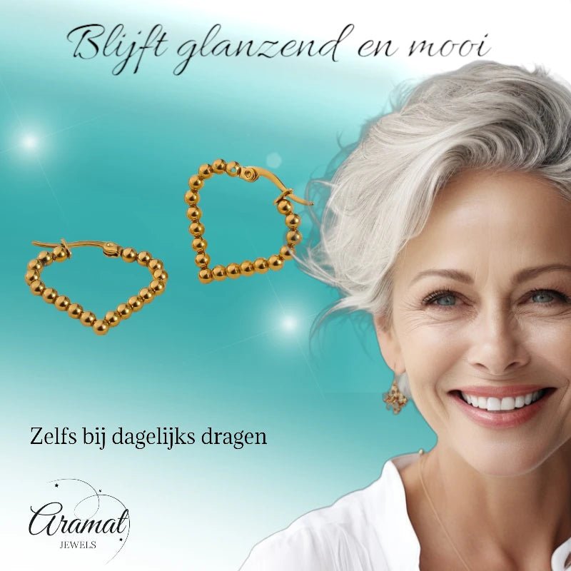 Goudkleurige stainless steel druppelvormige oorringen met bolletjesmotief – 33 mm - oor6410 - 514399 - Oorringen kopen# - 33mm - alles - bolletjes