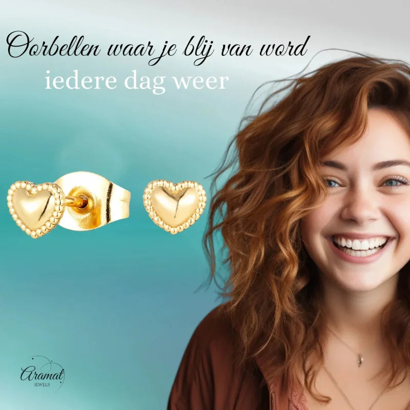 Gouden hart oorbellen.