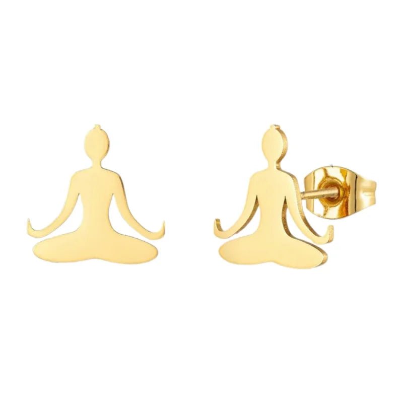 Gouden oorbellen in de vorm van mediterende figuren in lotushouding.