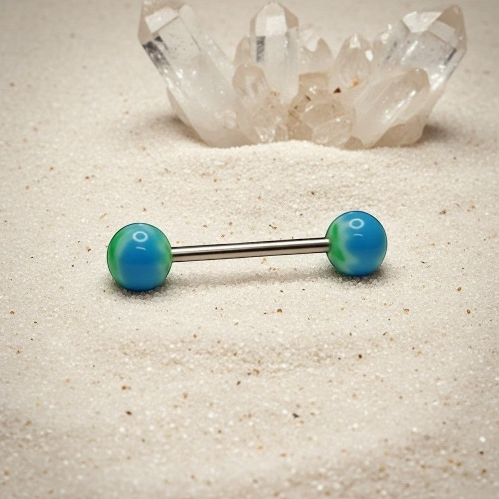 Aramat Jewels blue and green weed leaf tongue piercing made of surgical steel with marbled effect balls.