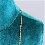 Stalen Koord Ketting Met Goudkleurige Koordschakel In Product Van ’aramat Jewels’.