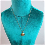 Ketting Met Gouden Disc Van Aramat Jewels