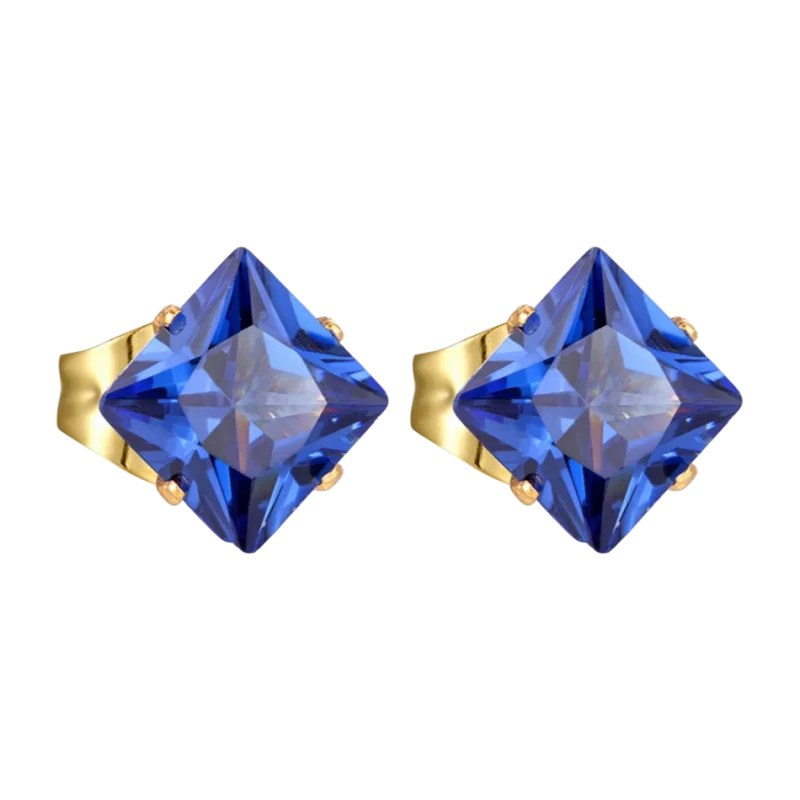 Paar oorbellen met blauwe edelsteen en gouden zetting.