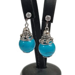 Oorbellen Met Turquoise Kraal En Stalen Oorhangers Van Aramat Jewels®