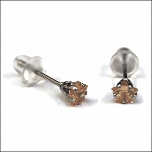 Zweerknopjes Zirkonia Oorbellen Stervorm Zilverkleurig / Champagne / 4mm