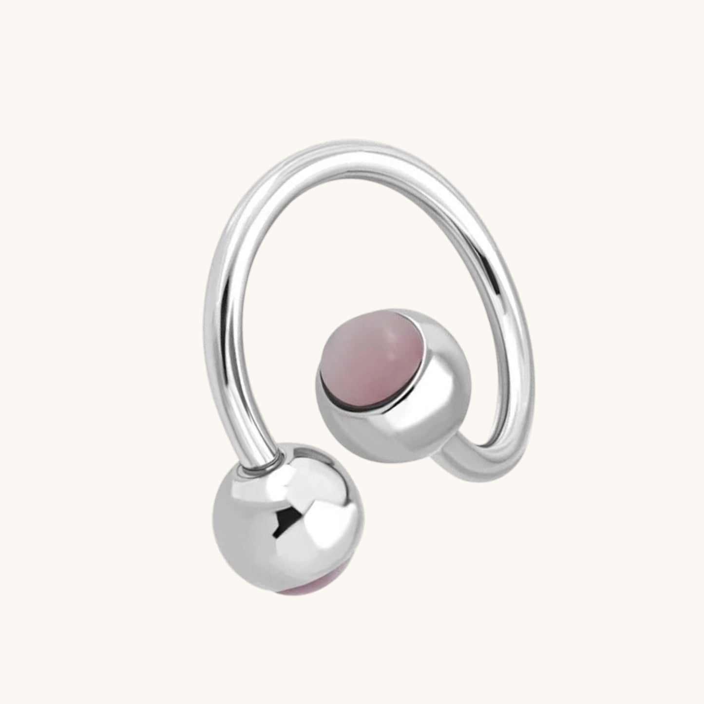Piercing au nombril en spirale d'acier œil de chat rose