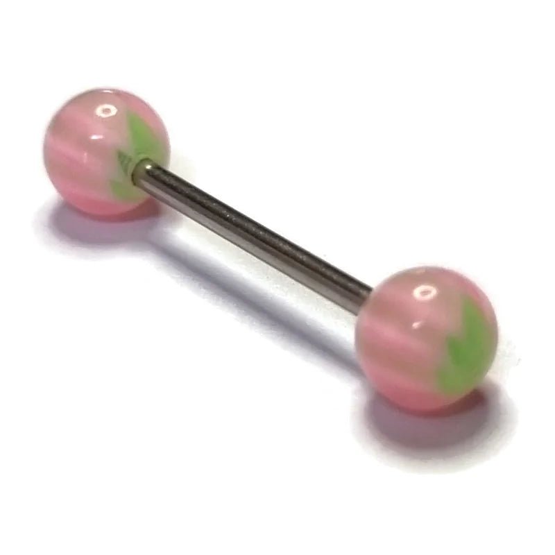 Een paar roze en groene ballen op een witte achtergrond