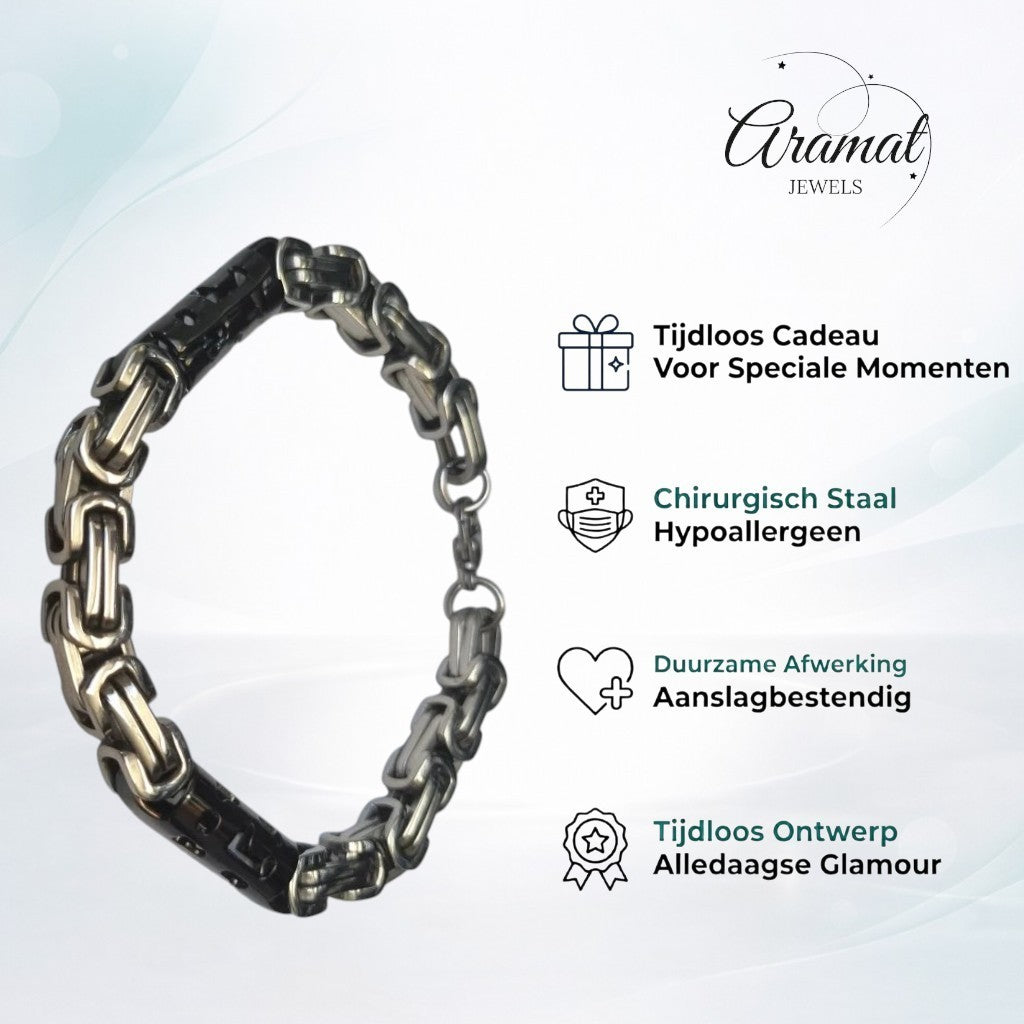 Een zwart met zilveren armband met een schakel