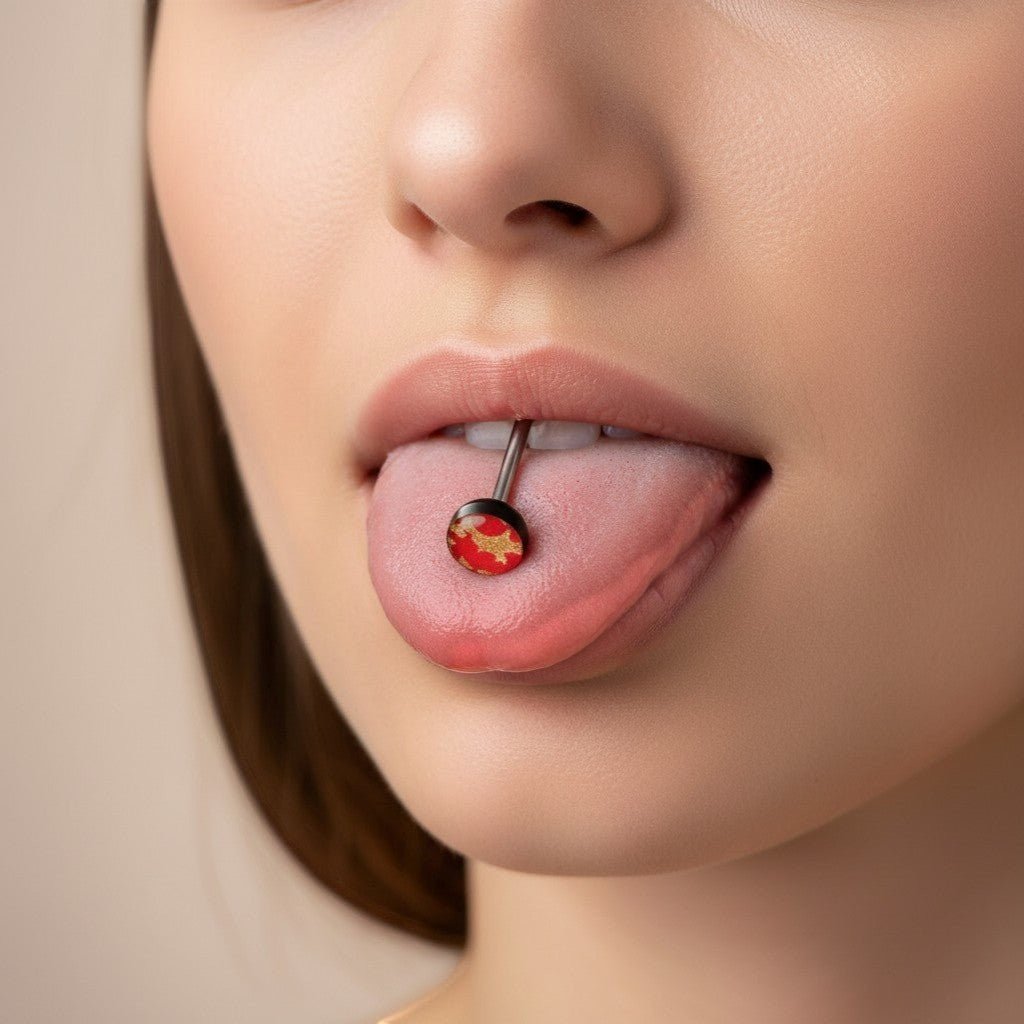 Aramat Jewels black and red camouflage print tongue piercing. Made of acrylic and surgical steel, 16mm length.