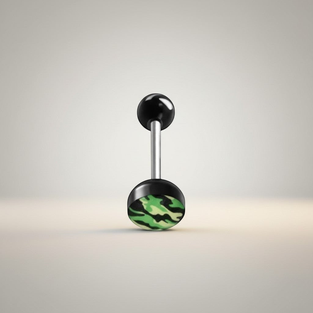 Aramat Jewels camouflage print tongue piercing. Features a black acrylic top ball and a black base with a green, black, and yellow camouflage pattern. Made of surgical steel.