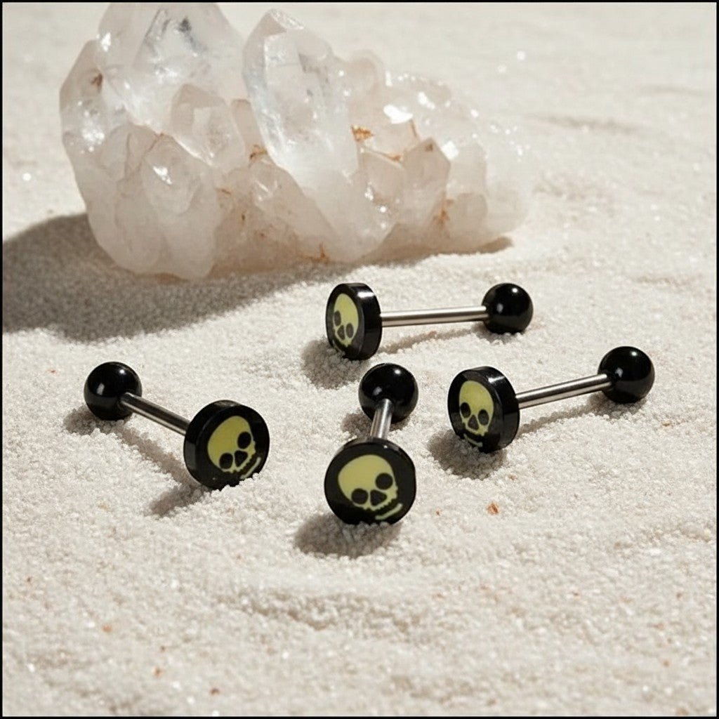 Aramat Jewels surgical steel tongue piercing with black acrylic skull logo and black balls.