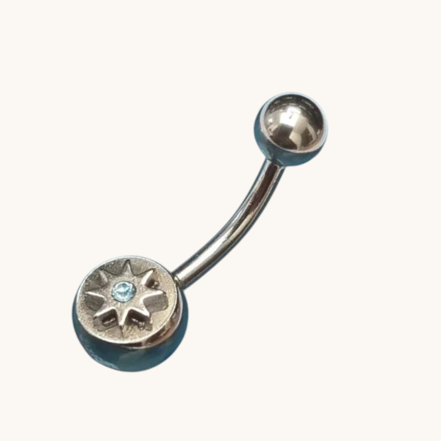 Piercing nombril en acier étoile avec zircon bleu