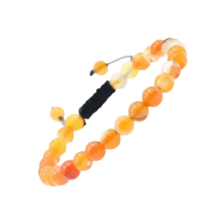 Kralenarmband met oranje en gele stenen in kleurverloop, verbonden met een zwart koord.