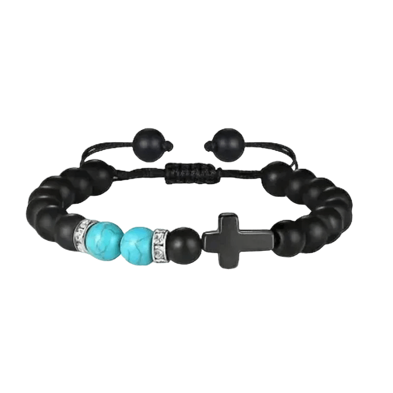 Een zwarte armband met turquoise kralen en een zilveren sluiting