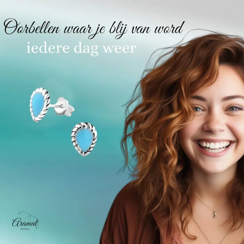 Turquoise oorbellen in de vorm van een druppel.