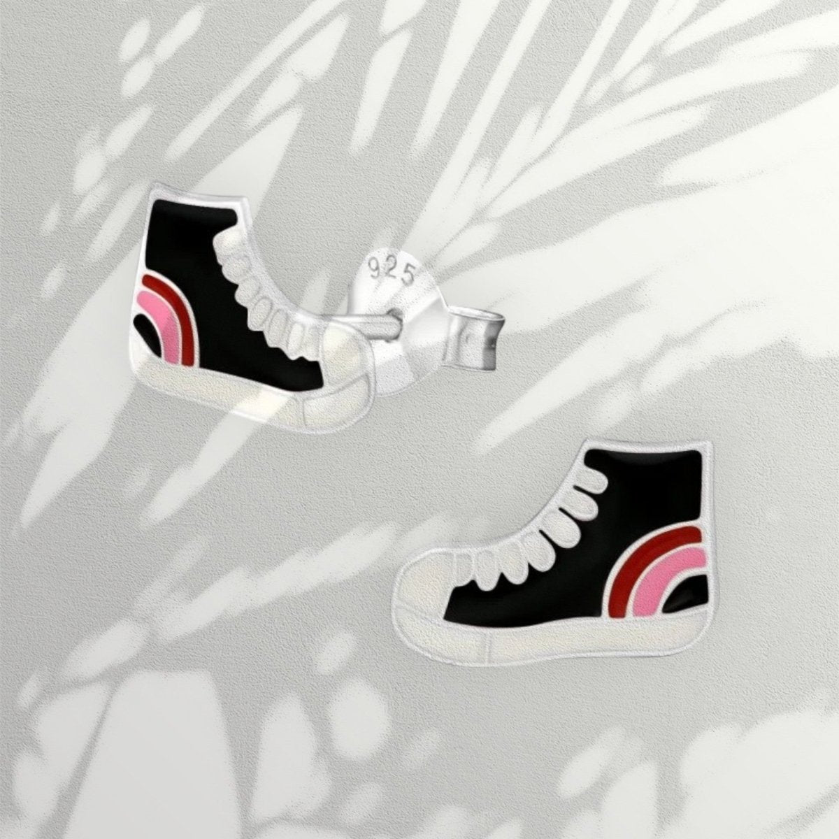 Aramat Jewels silver sneaker stud earrings with black enamel and pink/red accents, 10x6mm.