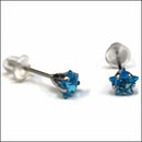Blauwe Kristallen Oorbellen Van Aramat Jewels Met Zirkonia Zweerknopjes